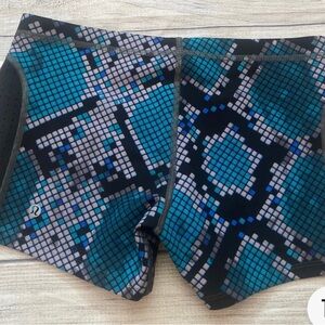 Lululemon Athletica Unisex Blue and Black Swim Trunks with Modern Design